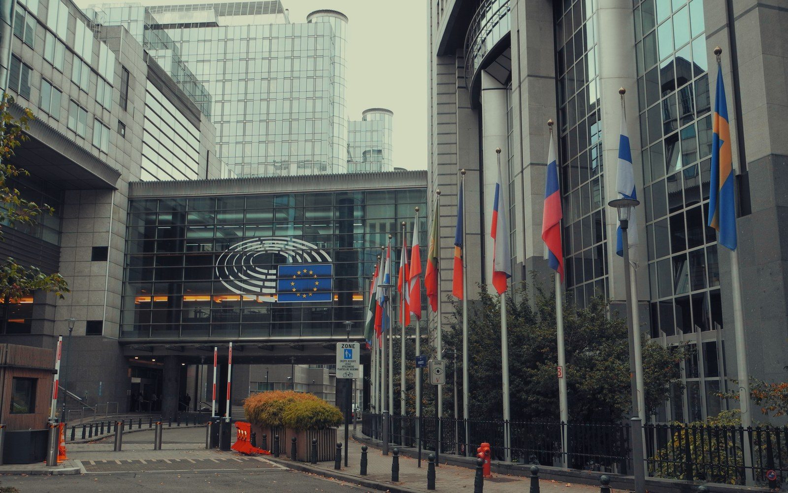 European Union member state flags line the entrance of the European Parliament building