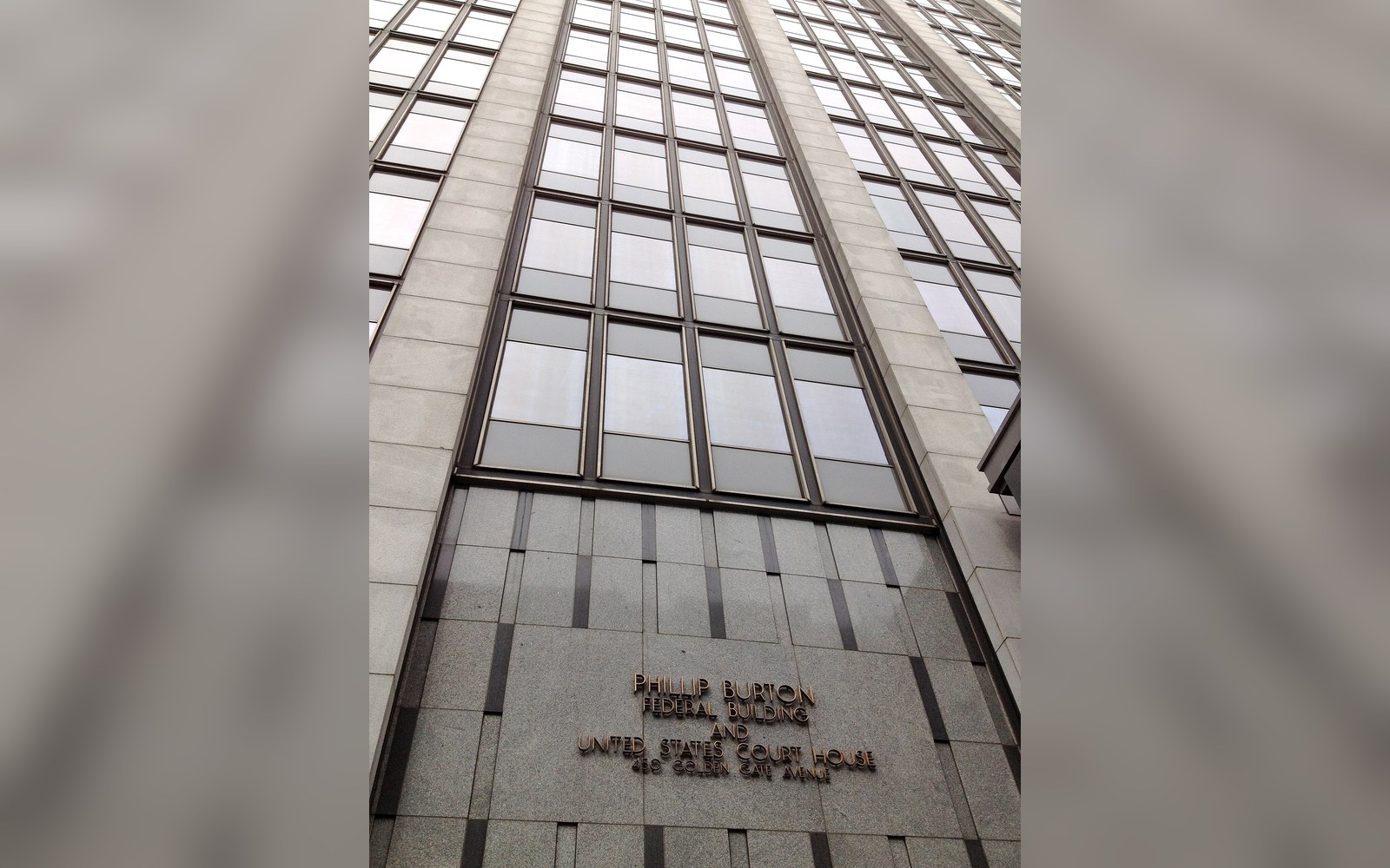 Upward view of the Phillip Burton Federal Building and United States Courthouse facade